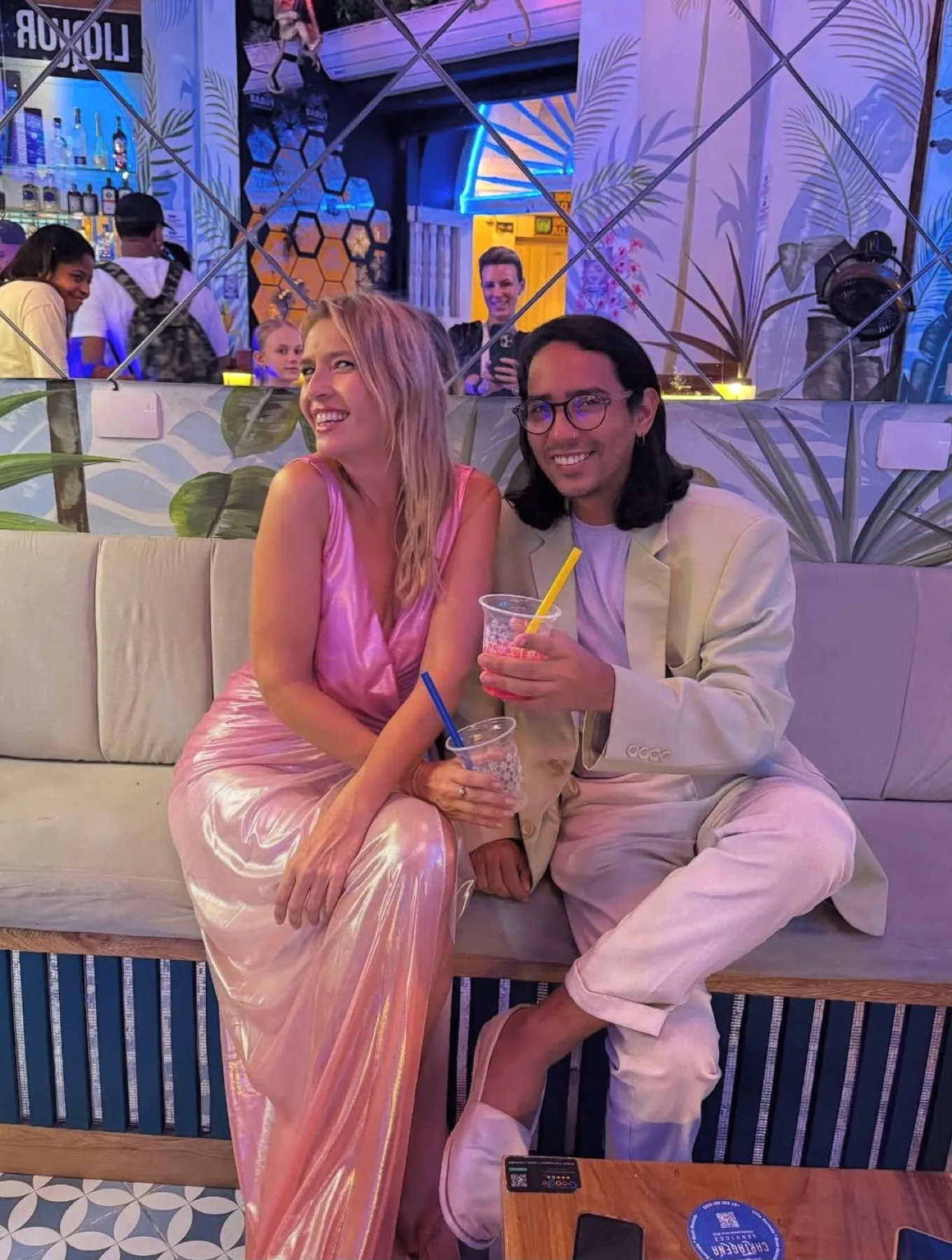 Friends enjoying frozen cocktails inside FÜBAR